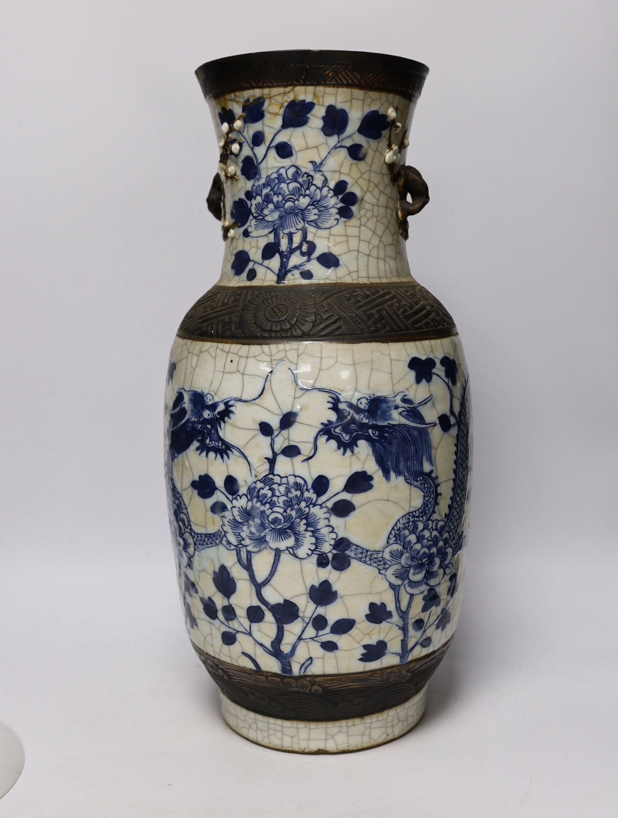 A large early 20th century Chinese blue and white crackle vase and a later plate decorated with children, 46cm high